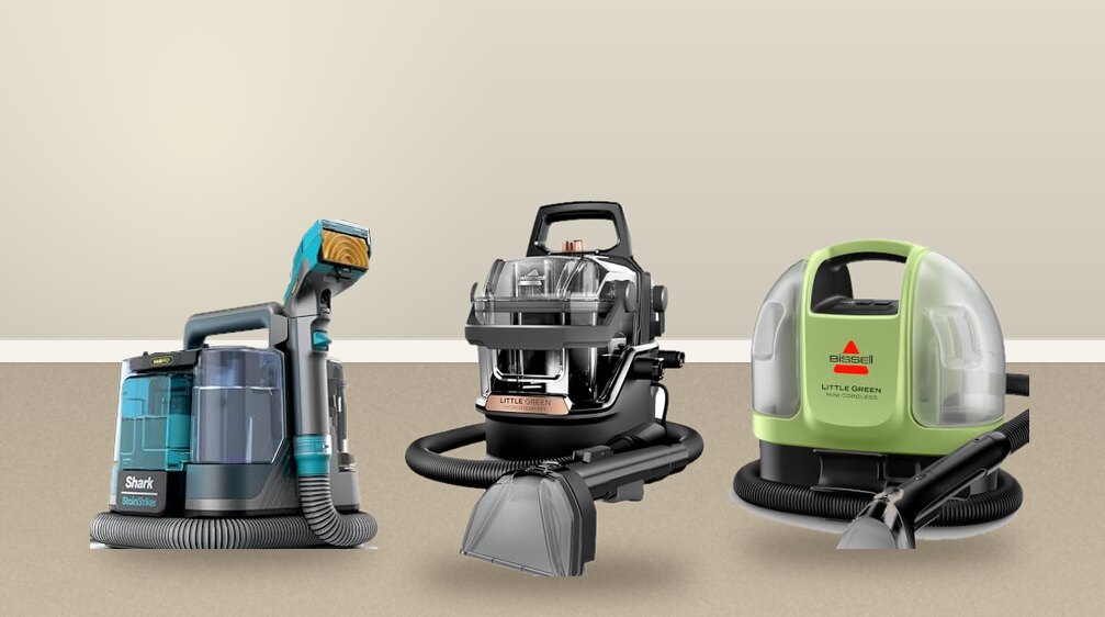 Shark StainStriker HairPro, BISSELL Little Green HydroSteam and Little Green Mini Cordless handheld carpet cleaners on a carpet
