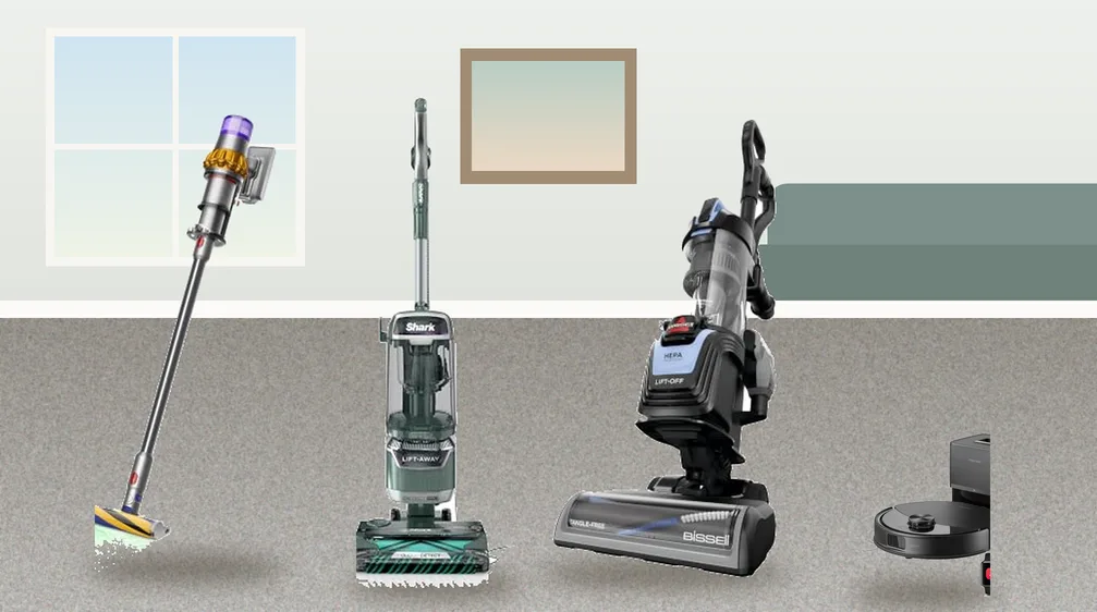 Upright, cordless stick and robot vacuums on low pile berber carpet in a living room