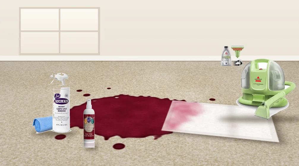 Red wine spill on a beige carpet with a white towel, carpet stain removers and a portable carpet cleaner